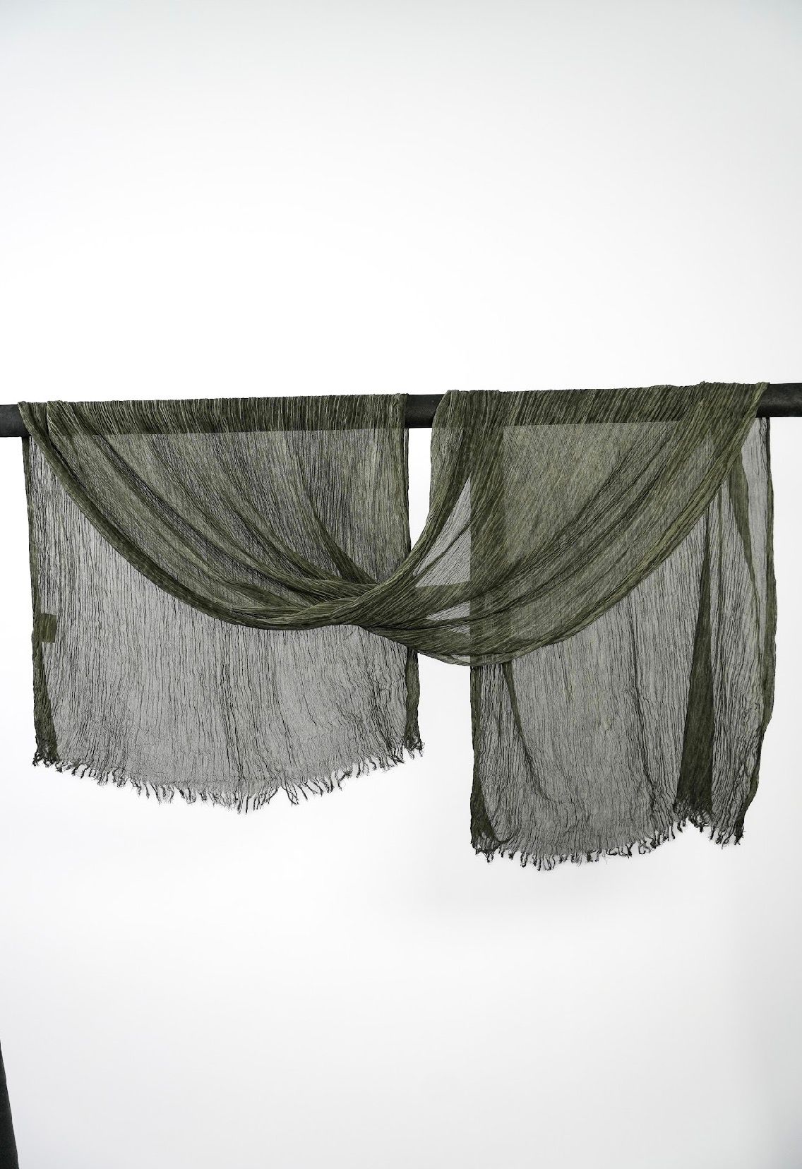 Creshia Forest crinkle hijab draped over a rod