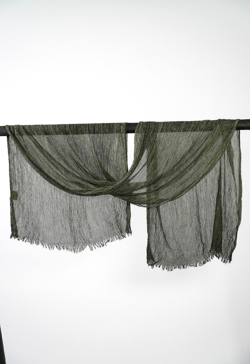 Creshia Forest crinkle hijab draped over a rod