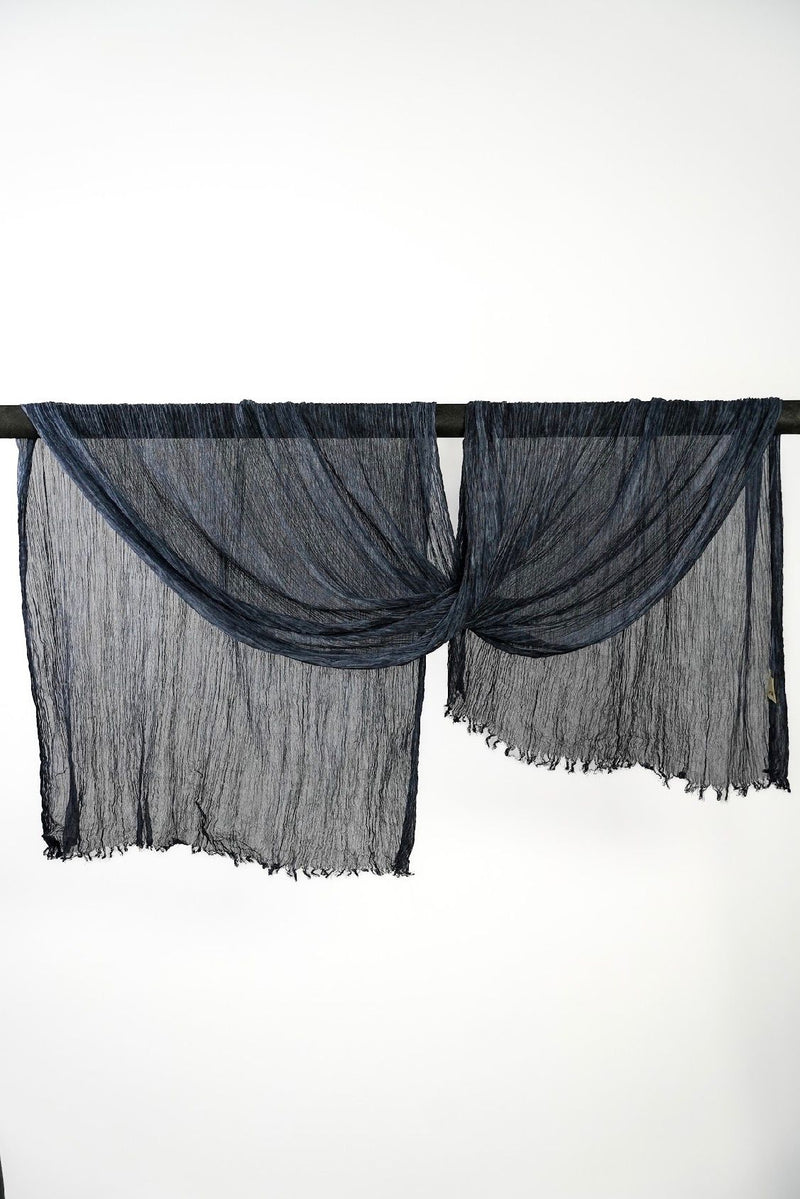 Creshia Midnight crinkle hijab draped over a rod
