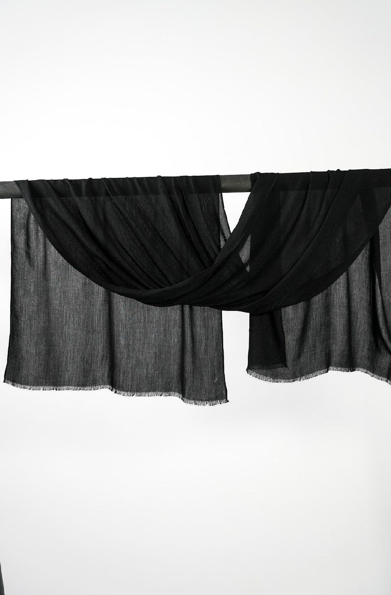 Mélange Deep Black hijab draped over a rod